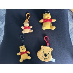 4 Mini Pooh Plush Keychains...